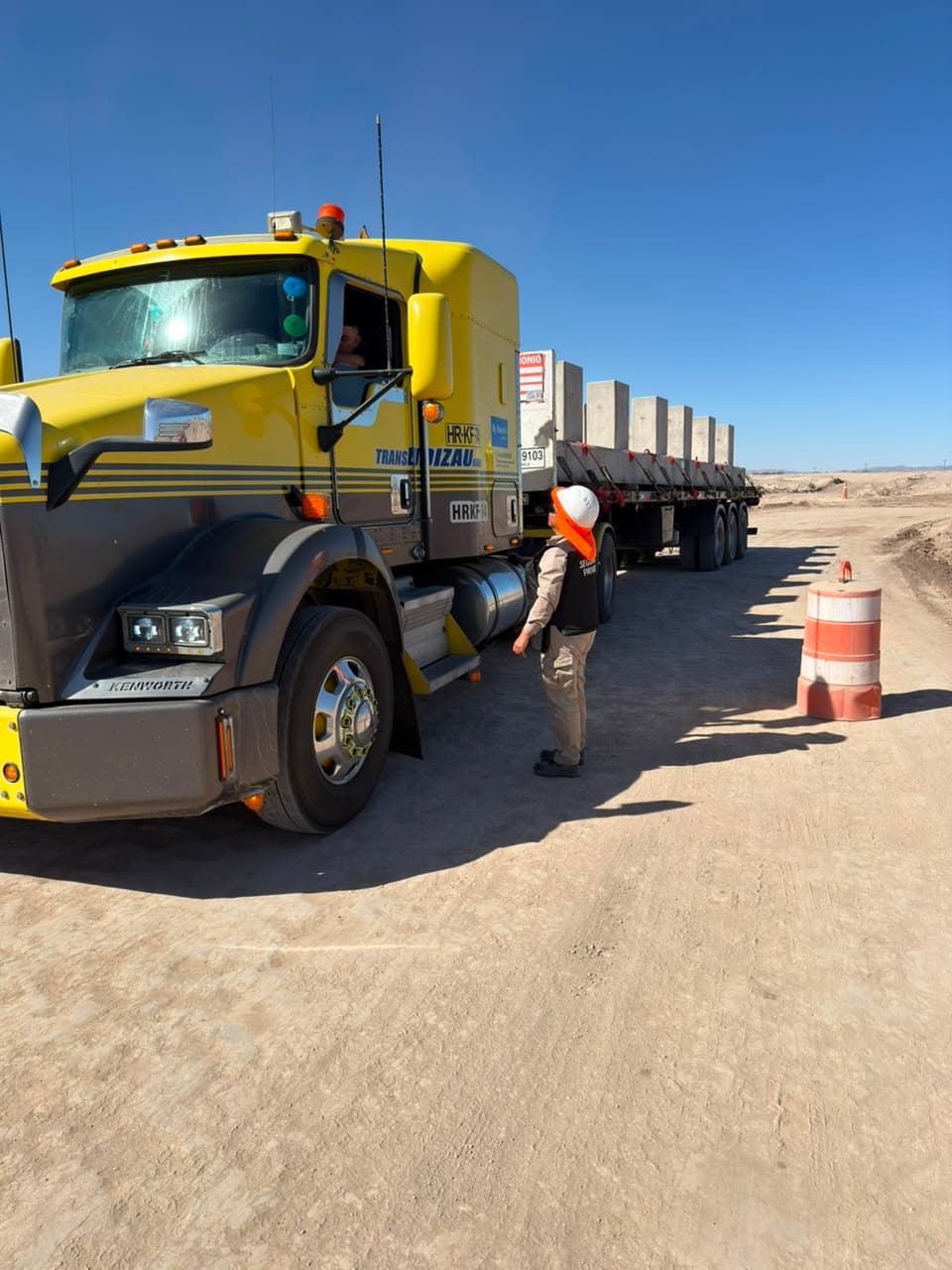 Inspection of a truck loaded with concrete slabs at a checkpoint